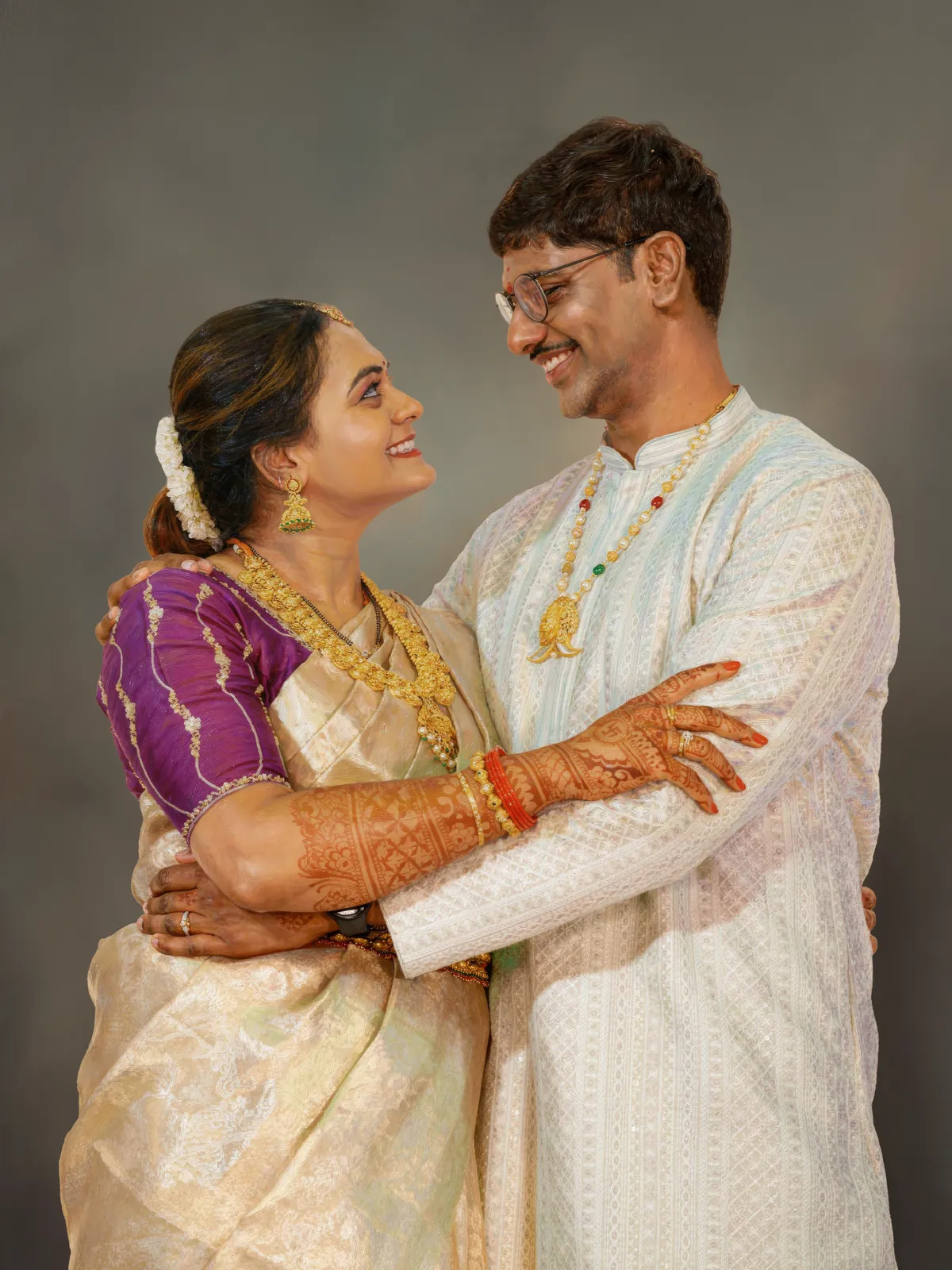 Digitally hand-painted portrait of a couple in traditional wear embracing