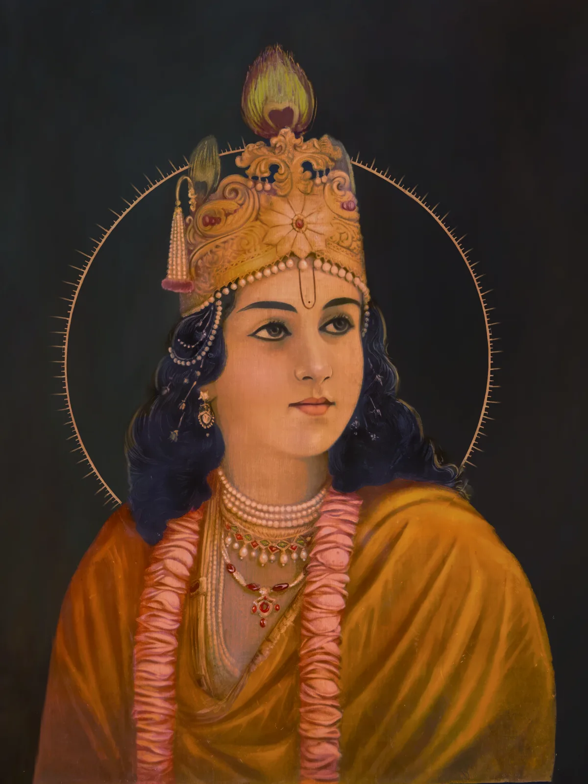 Krishna artwork with a golden crown against a dark background